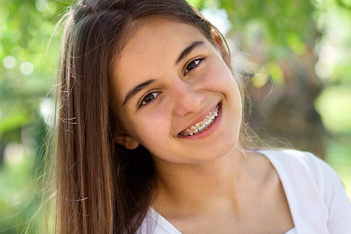 young girl with braces smiling